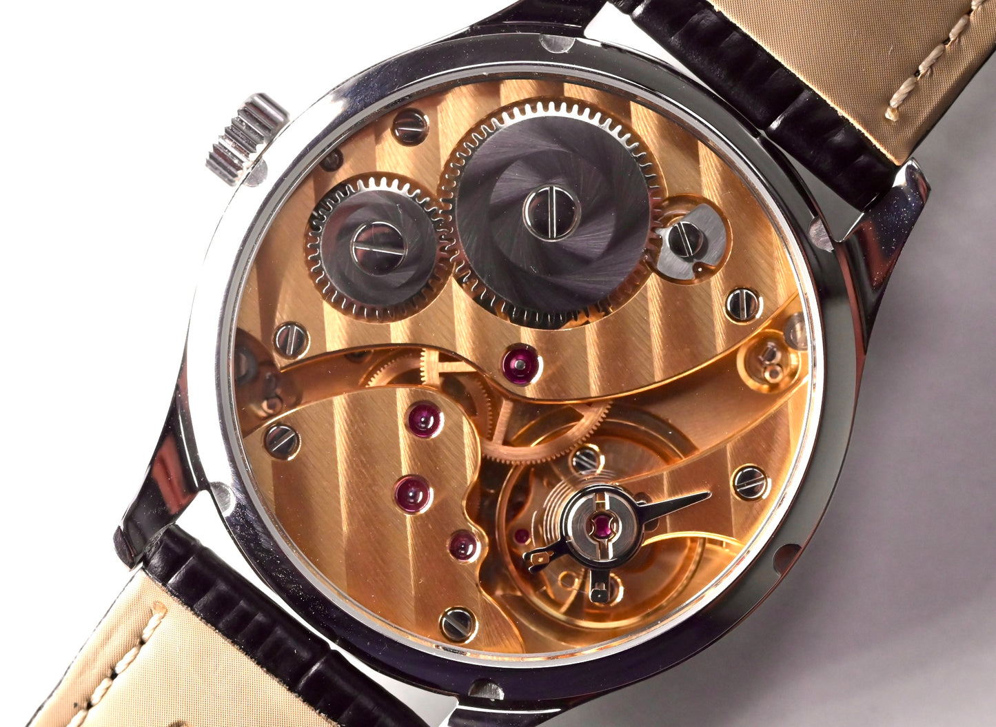 CHRYSOS  - Hand finished Swiss movement with gold movement and black MOP dial